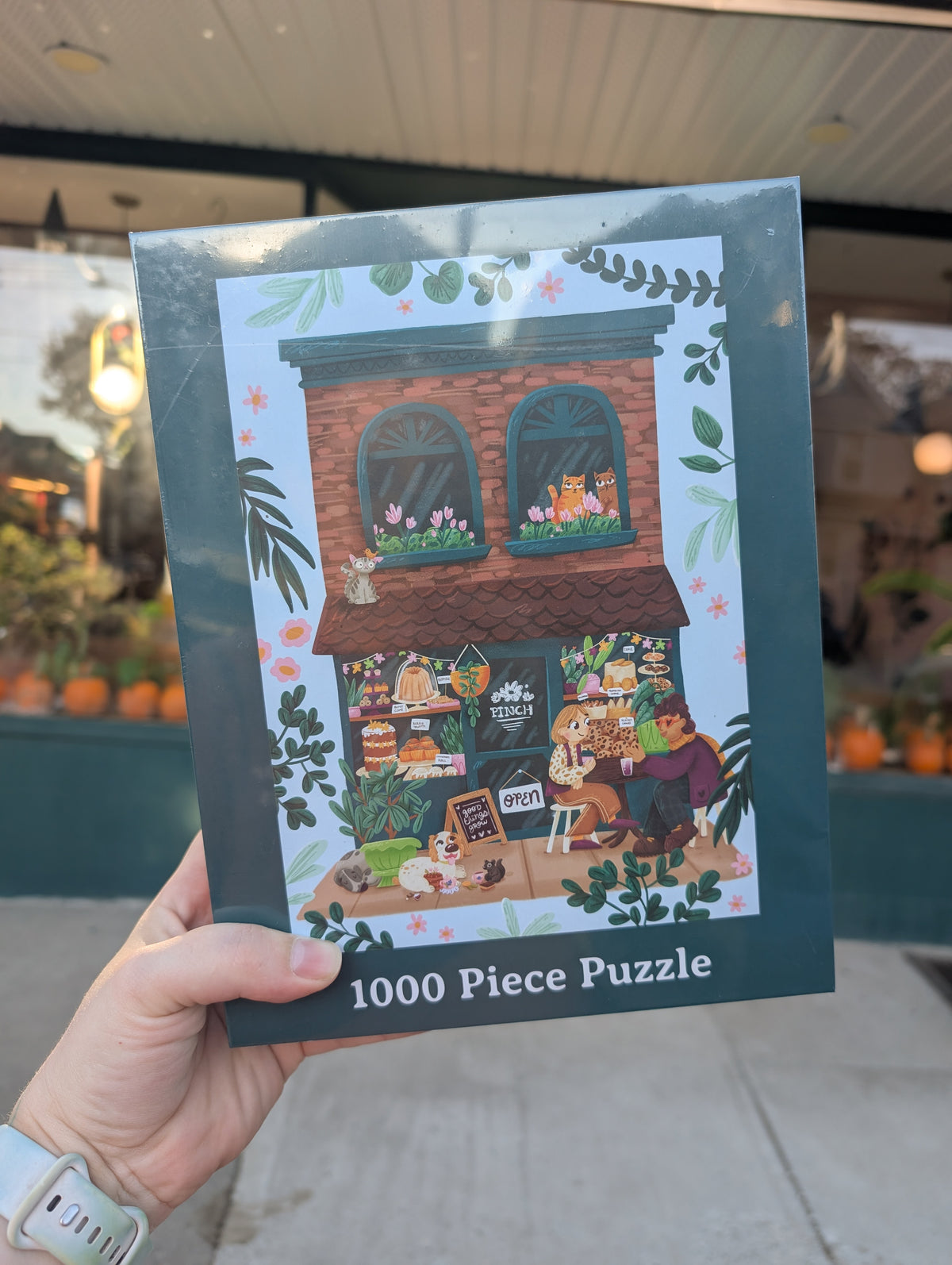 Pinch 1000 piece puzzle box in front of the shop