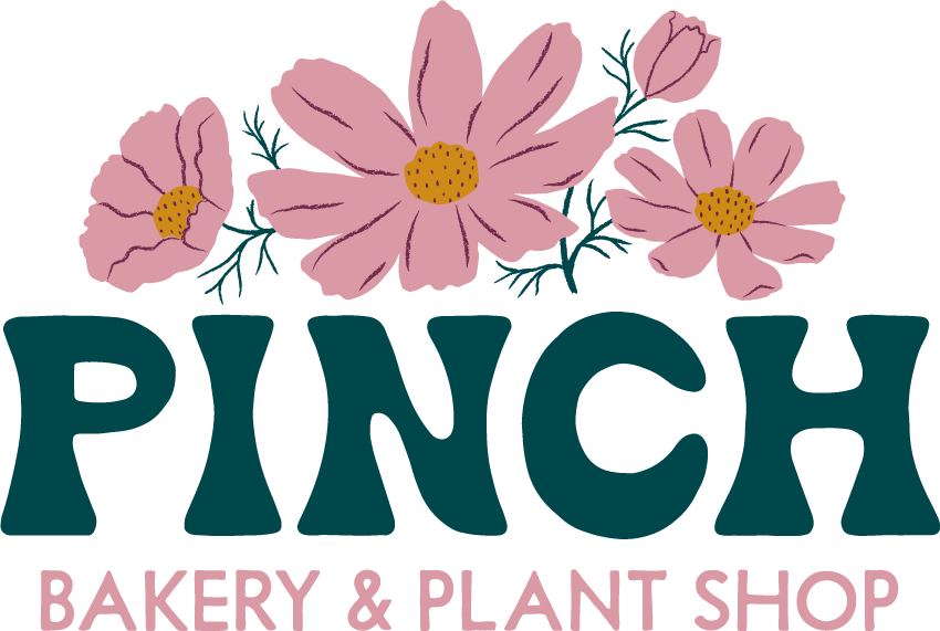 Logo for Pinch; 4 pink cosmos overtop a dark green display font reading "Pinch". Underneath is "Bakery & Plant Shop" written in a sans serif font in pink.